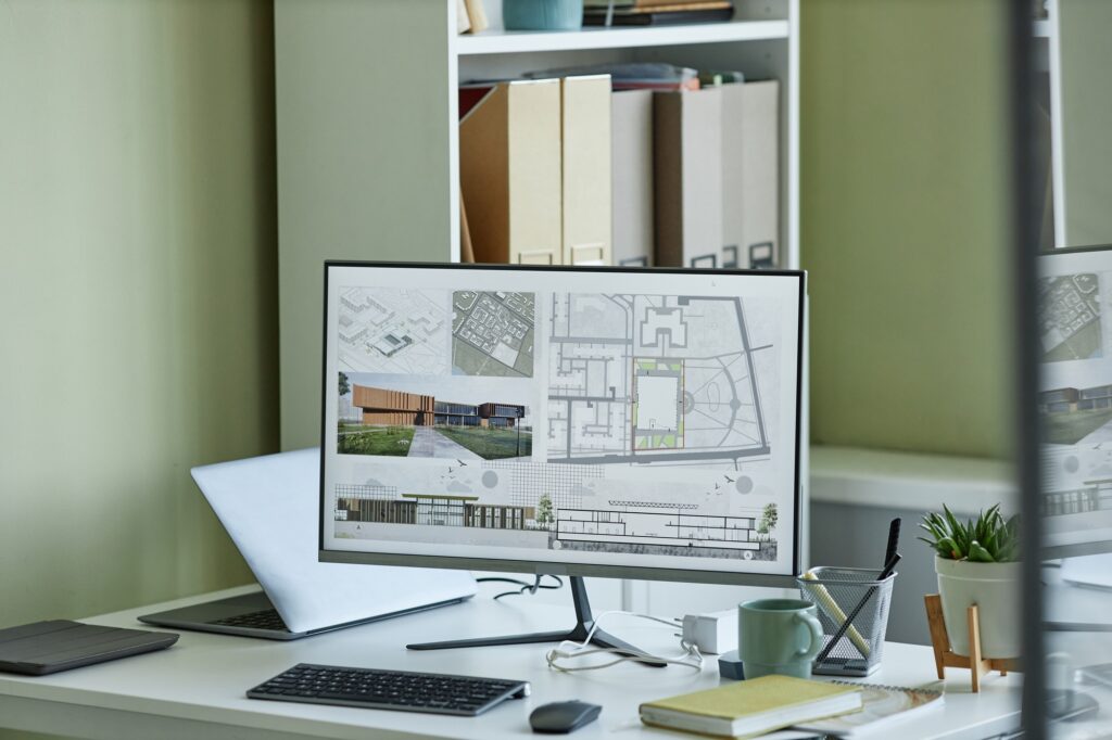 Close up of computer with 3D blueprints